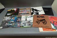 View of all ten classic rock albums laid out showing album covers including AC/DC, Meat Loaf, The Who, Eagles, Eric Clapton, Quadrophenia and more.