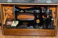 Close-up of sewing machine body and decals inside case
