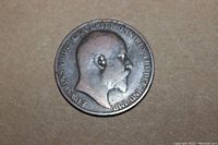 Obverse side of the 1902 Great Britain penny showing King Edward VII profile with worn copper surface and visible inscription.