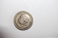 Obverse side of the 1929 Great Britain 6 pence silver coin showing King George V's profile and surrounding inscription.