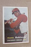 Front of the 1957 Frank Robinson Topps rookie card showing player in batting stance with Cincinnati Redlegs uniform; card number 35.