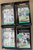 Four unopened black foil packs of 1993 Pinnacle Series 2 Baseball cards featuring different MLB player images on the front with Series 2 and Score branding.