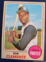 Front image of 1968 Topps Roberto 'Bob' Clemente baseball card #150 showing player holding bat in Pirates uniform.