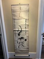 Full view of entire scroll hanging on wall