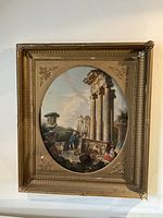 Full view of oval oil painting with ornate gilt wood frame