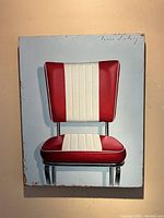Full frontal view of painting showing the red and white diner chair against pale blue background