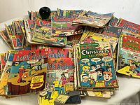 Wide view of stacked and fanned covers showing Life with Archie, Laugh with Archie and Archie's Joke Book titles