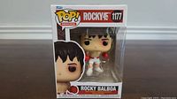 Front view of boxed Rocky Balboa Funko Pop figure, showing character and box art.