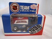 Front side photo of the 1996 Colorado Avalanche NHL souvenir Zamboni in original packaging showing the limited edition sticker and NHL logo.