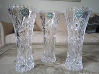 Three Lenox fine crystal vases displayed upright on a table with visible Lenox brand stickers on each.