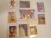 Top view showing all eight Michael Jordan sports cards laid out on white surface.