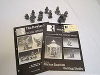 Two original Michael Anthony Ricker pewter collectibles catalogs featuring multiple figurines