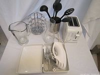 Full lot view showing all items on white table.