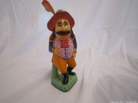 Full front view of carved wooden Russian nutcracker figurine showing detailed colorful painting and standing pose.