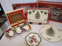 Overview photo showing all five pieces in the Spode Christmas Tree pattern serving set including large rectangular platter, divided server, cake plate, cookie plate, and cake server.