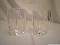 Pair of heavy Waterford Marquis crystal lo-ball glasses, showing vertical cut pattern and clear crystal.
