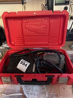 Red plastic case containing foot pedal, SR motor and die grinder