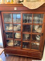 Full front view of china cabinet closed, showing overall style and condition