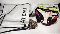 13 pairs of new women's underwear with tags in various colors and patterns