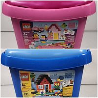 Pink plastic bin containing LEGO Set 5585 with label showing 216 pieces and a house build with figures and vehicle
