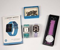 Smart Watch in original box, three wristwatches with decorative bands, and small blue box with vintage keys
