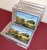 Five sealed PST model kits featuring ZIS-5 truck and 37 mm AA gun model from 1939, stacked together.