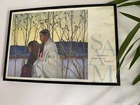 Framed wall picture from Smithsonian American Art Museum showing a Native American couple with natural background and museum label.