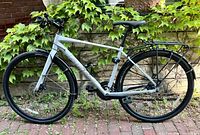 Full left-side view of concrete gray frame with fenders and rack