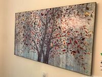 Front angled view of the rectangular art piece showing the full tree and the wood plank background.