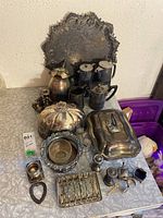 Wide view of all pieces arranged on table against wall