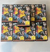 Image showing a partial arrangement of 9 Lost In Space video cassette boxes, all with consistent artwork.