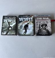 Photo showing three DVD sets on WWII: Warbirds WWII, Great Battles of WWII and The War 1941-1945 PBS Home Video.