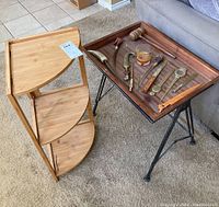 Wood corner shelf and metal and wood side table photographed together, side table holding letter openers laid out on the tray.