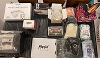 Overview of kitchen appliances, organizer, apparel, and footwear items organized on a black background.