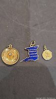 Three charms on black background (overview)