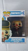 Front view of unopened Funko Pop Fortnite 429 Crackshot figure in box, showing character image and branding.