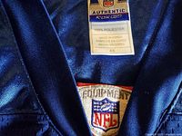 Close-up of the neckline tags showing NFL Authentic and Reebok branding, size 48, made in Korea.