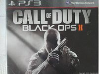 Front cover of Call of Duty Black Ops II PlayStation 3 game case showing soldier with pistol and title.