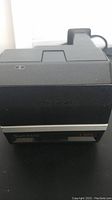 Close-up front angle of Polaroid Sun 600 LMS instant camera showing lens area and branding