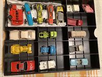Overview of the full collection of small vintage metal vehicles inside the compartmentalized A/FX Pit King box.