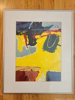 Full framed abstract painting with mat, showing yellow, blue, gray, red, and black coloration
