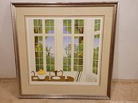Full frontal view of framed print showing dining table and window scene
