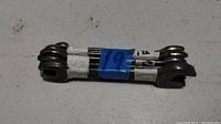 Close-up of a bundled set of 5 double open-end metal wrenches with visible sizes 18 mm and 19 mm on heads.