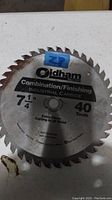 Close-up photo of Ridgid 7 1/4 inch combination/finishing circular saw blade with 40 teeth, showing text and condition.