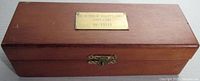 Top view of closed wooden case with brass plaque marked 'THE RETURN OF HALLEY'S COMET 1985-1986 NO. F0569'