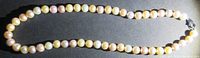 Full view of the 17-inch cultured pearl necklace showing the variety of colors and the sterling clasp.
