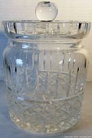 Front angle of the Waterford crystal jar showing detailed cut patterns and crystal knob lid.
