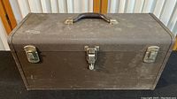 Front view of the vintage Kennedy metal toolbox showing latches and handle