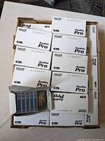 Box with multiple sealed Maxell Audio Pro R-20DA (10 pcs each) white boxes showing quantity and packaging