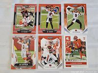 Photo showing six Bengals football cards featuring Tee Higgins, Joe Burrow (3 cards), Chad Johnson, and Ja'Marr Chase.